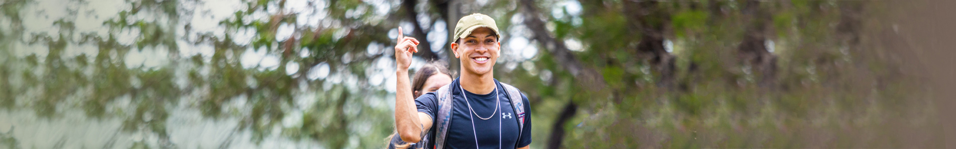 A Concordia freshman student doing the CTX woosh sign