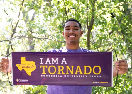 Concordia University Texas student celebrating becoming a Tornado