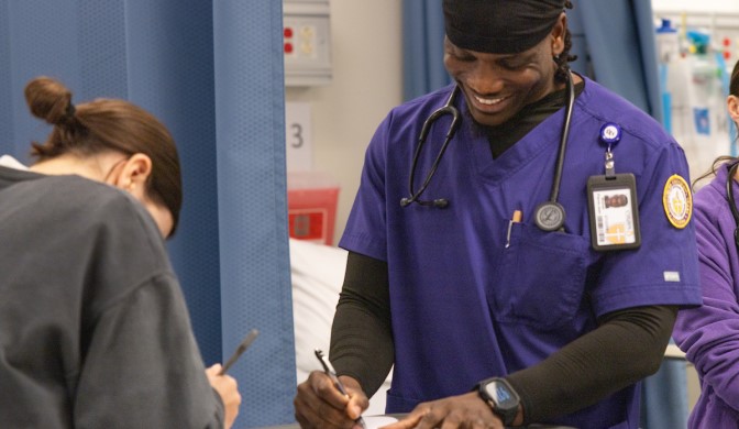 A Concordia Nursing student on campus working in a lab
