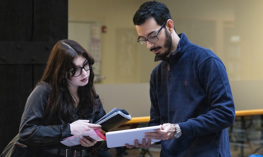 A pair of students going over their notes from a recent lecture.