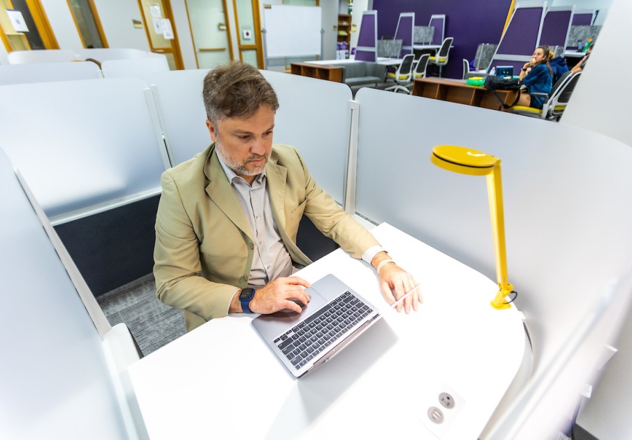 A graduate student working on campus