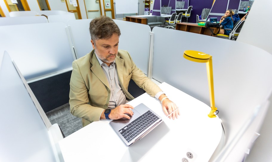 An adult learner working in the study lab