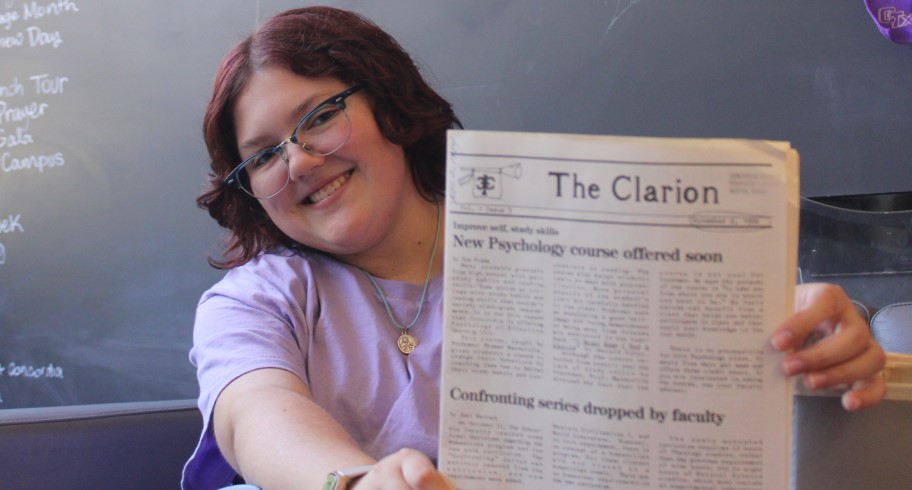 Abby Shaivitz with a copy of The Clarion