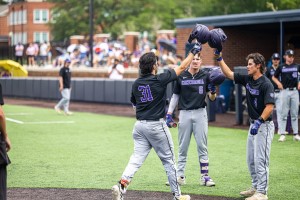 Concordia Texas baseball players tapping helmets