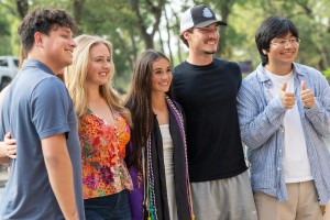  Concordia University Texas student celebrating graduation on campus in Austin
