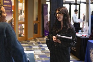A career fair on campus with a pair of women conversing