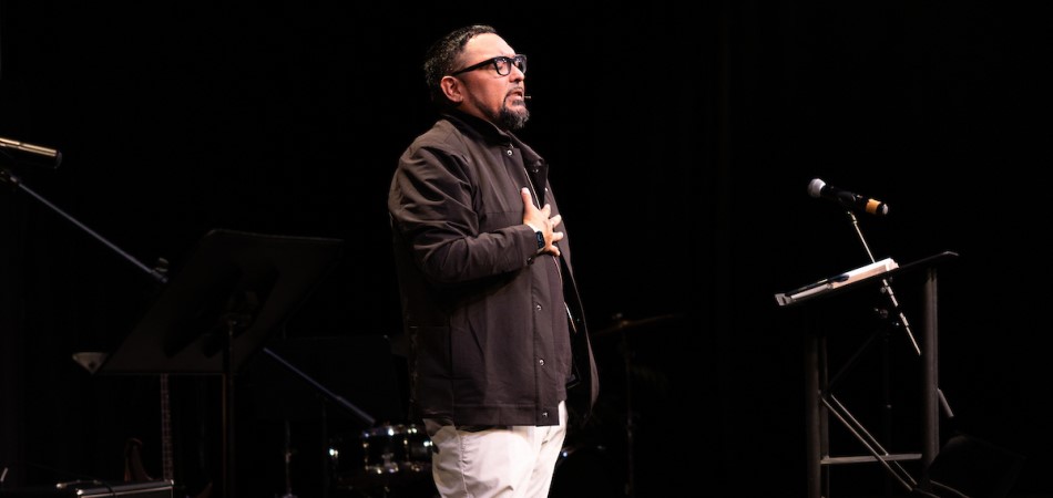 Rev. Dr. Chris Holder leading worship