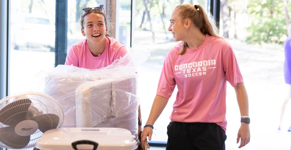 A pair of CTX students moving into the dorms.