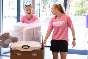 A pair of CTX students moving into the dorms.