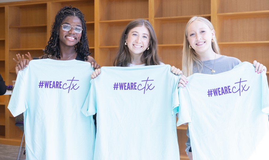 Students displaying a CTX shirt